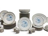 a lot of plates and cups on the table
