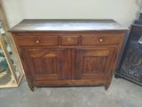 a wooden cabinet with two drawers and a marble top