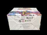 a box of candy sitting on a black surface