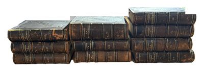 books stacked on top of each other on a white surface