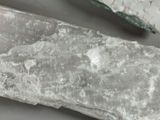 a knife and a rock on a table