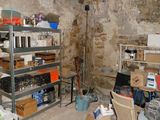 a room that has a bunch of items on the shelves