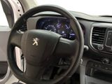 the interior of a car with a steering wheel and dashboard controls