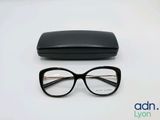 a close up of a pair of glasses and a case on a table