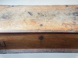 an old wooden box that is sitting on a table