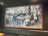 a picture of a painting on the wall of a restaurant