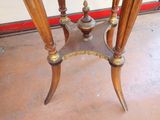 a small table with a glass top and a wooden base