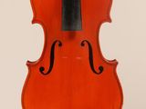 an orange violin with a black bow hanging from it ' s back