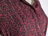 the dress is red and black with a leopard print on it