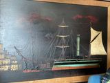 une photo d'un tableau sur le mur d'un salon