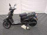 a scooter that is parked on a checkered floor