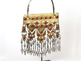 silver and gold plated purse with red beads and chains