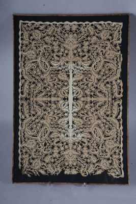 a close up of a piece of cloth with a cross on it