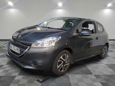 the grey car is parked on a checkered floor in the garage