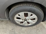 a close up of a car ' s tire on the pavement