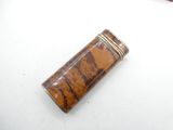 an image of a lighter sitting on top of a white table