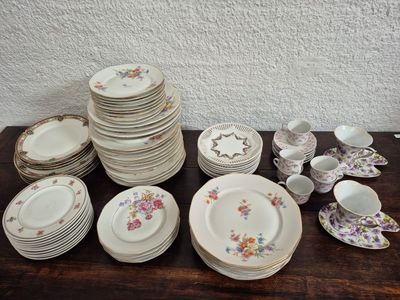 a lot of plates and cups on the table