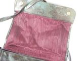 a purse that is sitting on a white surface