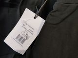 a close up of a black jacket with a price tag on it