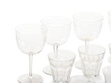 a lot of empty wine glasses sitting on a table