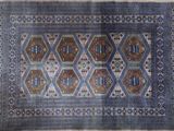a blue and brown rug with a pattern on it