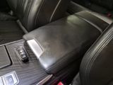 a cell phone in the center console of a car