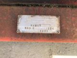 a rusted sign on the side of a rusted car