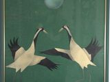 two birds that are standing in front of a green background