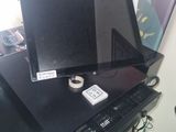 a laptop computer sitting on top of a computer desk