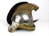 a silver helmet with black hair on a white background
