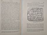 an open book with a drawing of a block of stone on it