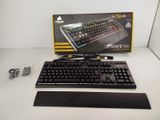 a computer keyboard and mouse sitting on a table