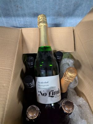 bottles of wine in a cardboard box filled with bottles of wine