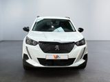 the front view of a white car parked in a showroom