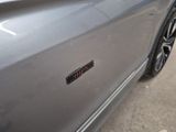 a close up of a car door with a sticker on it