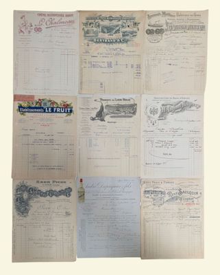 some old papers are stacked on top of each other on a table