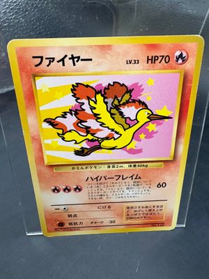 a pokemon card with a yellow bird on it
