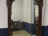 a mirror that is sitting on the floor in a room