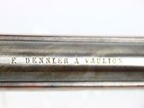 a close up of a knife on a white surface with the words e denner aviation written on it