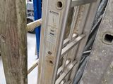 a close up of a metal ladder in a warehouse