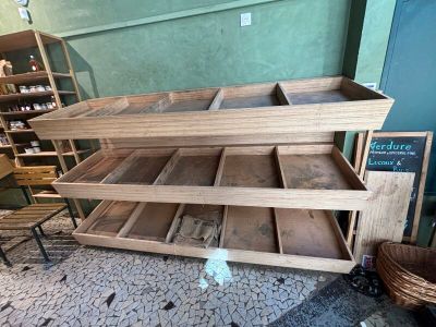 a wooden shelf that has a lot of shelves on it