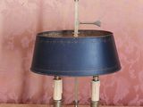 a lamp that is sitting on a table in front of a wall