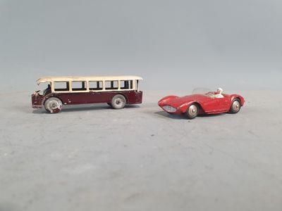 two toy cars sitting next to each other on a table