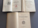 three open books sitting on top of a table next to each other