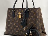 Sac à main Louis Vuitton en cuir marron à motif Monogram, avec finitions dorées