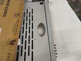 a laptop sitting on top of a box on a table