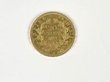 an image of a gold coin on a white surface