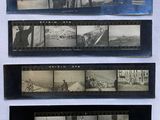 several old black and white photos of people and vehicles on a wall