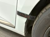 a close up of a car with a tape on the side of it