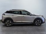 the silver nissan suv is parked in a large room